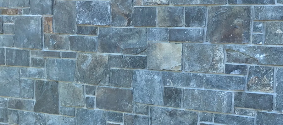Vermont Verde Mica thin stone veneer cladding in a blue-green square and rectangle pattern.